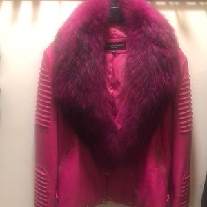 Woman’s pink leather and fur coat